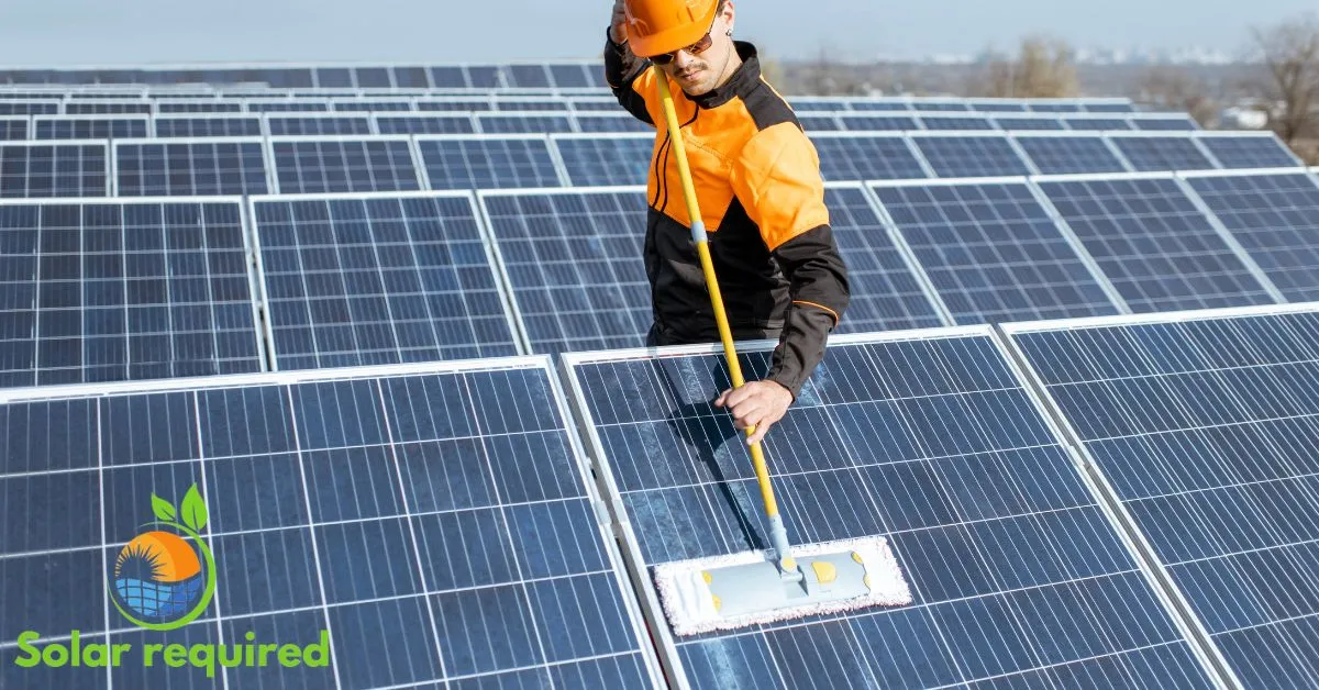 man clean solar panel