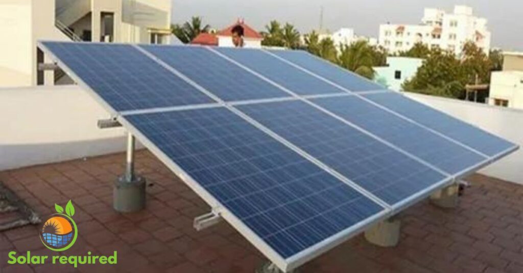 Solar panels on rooftop with building backdrop.
