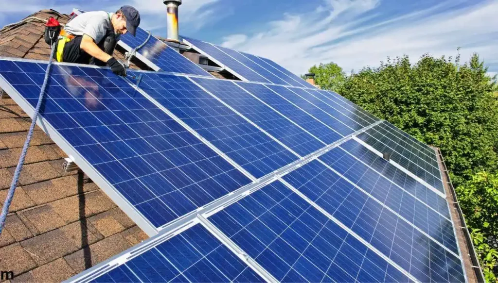 Professional solar panel installers busy in the process of solar panel installation