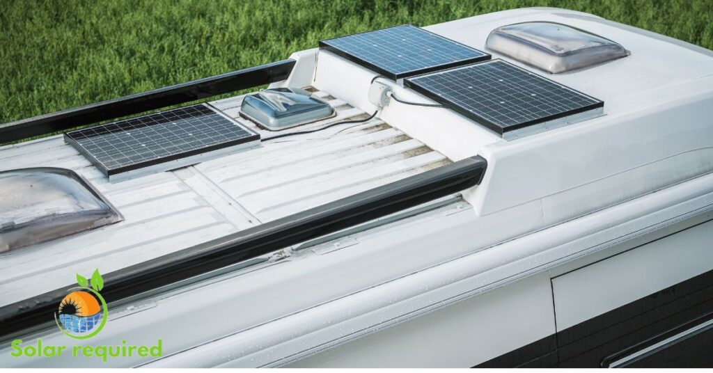 A white camper van with a solar panel on top, harnessing the power of the sun for energy.

