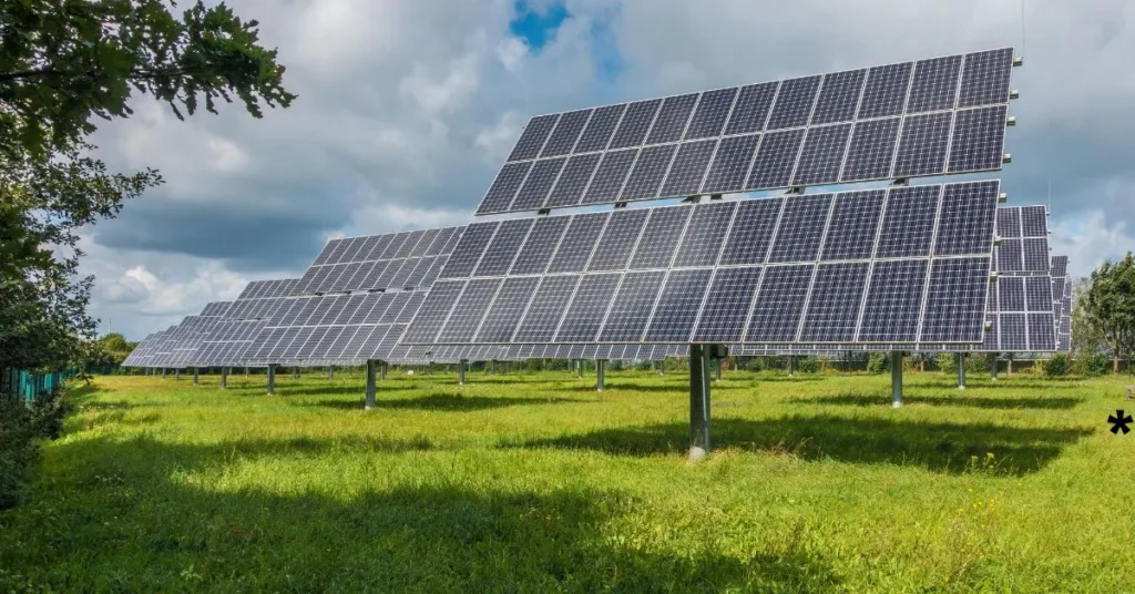 Solar panels installed on a vast field, harnessing sunlight for renewable energy generation.