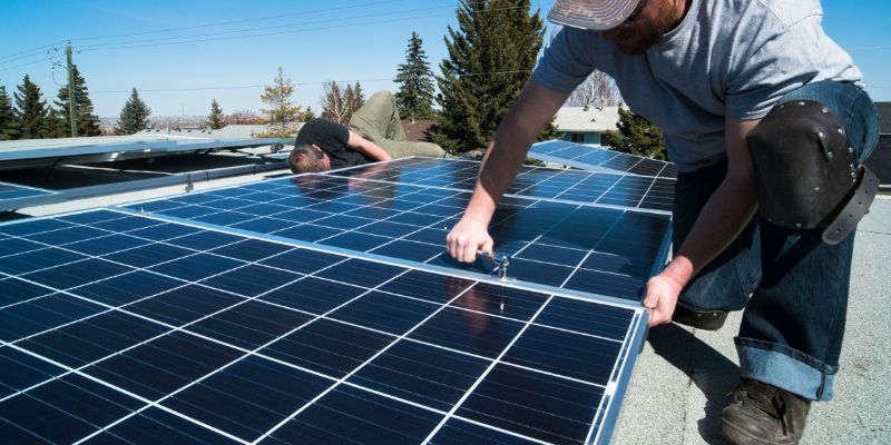 two expert man install solar panels